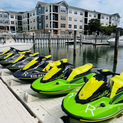 a row of parked motorcycles sitting in front of a building