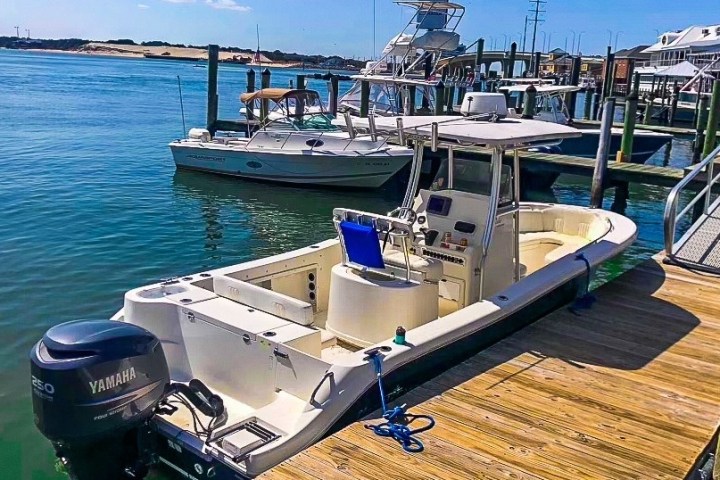 a boat that is sitting on a dock near the water